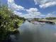 Scenic waterfront docks with several boats on a calm day, surrounded by lush greenery at 504 Hawthorne Blvd, Leesburg, FL 34748