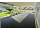 Spacious covered carport area with new flooring offers ample parking and entertaining space at 504 Hawthorne Blvd, Leesburg, FL 34748