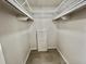 Walk-in closet provides ample storage with shelves at 504 Hawthorne Blvd, Leesburg, FL 34748