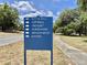 Community sign listing available recreational activities such as bocce ball, softball, and kayaking at 504 Hawthorne Blvd, Leesburg, FL 34748