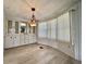 Bright dining area with custom built-in cabinets and stylish hanging light fixture at 504 Hawthorne Blvd, Leesburg, FL 34748