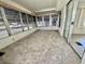 Relaxing Florida room with lots of windows, carpet flooring, and access to the outside for year-round enjoyment at 504 Hawthorne Blvd, Leesburg, FL 34748