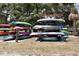 Kayak Club with stacked kayaks and canoes, set against a backdrop of trees at 504 Hawthorne Blvd, Leesburg, FL 34748