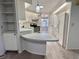 Bright kitchen with stainless steel appliances and breakfast bar, perfect for dining at 504 Hawthorne Blvd, Leesburg, FL 34748