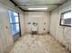 A blank utility room with a slop sink and a window air conditioner provides great potential at 504 Hawthorne Blvd, Leesburg, FL 34748