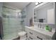 Modern bathroom with stylish tile, updated vanity, and glass shower at 517 San Pedro Dr, Lady Lake, FL 32159