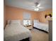 Bright guest bedroom with twin beds and a calm, inviting aesthetic at 517 San Pedro Dr, Lady Lake, FL 32159