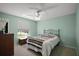 Comfortable bedroom with neutral walls, a ceiling fan, and ample light at 517 San Pedro Dr, Lady Lake, FL 32159