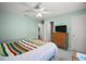Comfortable bedroom with neutral walls, a ceiling fan, and ample closet space at 517 San Pedro Dr, Lady Lake, FL 32159