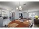 Open-concept view of dining room leading to kitchen and living area, perfect for entertaining guests and Gathering at 517 San Pedro Dr, Lady Lake, FL 32159