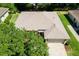 An aerial shot features the property's well maintained lawn and attached two-car garage at 5209 Grove Mnr, Lady Lake, FL 32159