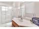 Bright bathroom with a large vanity and shower with glass doors at 5209 Grove Mnr, Lady Lake, FL 32159
