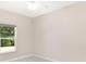 Bedroom with a large window at 5209 Grove Mnr, Lady Lake, FL 32159