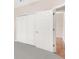 Spacious walk-in closet providing ample storage space with bi-fold doors and convenient access at 5209 Grove Mnr, Lady Lake, FL 32159