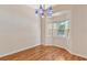 Inviting dining area filled with natural light from a bay window, complemented by hardwood floors at 5209 Grove Mnr, Lady Lake, FL 32159