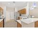 Bright kitchen featuring stainless steel appliances, wood cabinets, and breakfast bar at 5209 Grove Mnr, Lady Lake, FL 32159