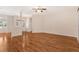 Bright living room featuring hardwood floors and neutral paint, great for modern living at 5209 Grove Mnr, Lady Lake, FL 32159
