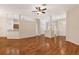 Open-concept living room featuring hardwood floors and neutral paint, perfect for entertaining at 5209 Grove Mnr, Lady Lake, FL 32159