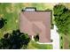 Aerial view of the house showing the roof, the backyard, and the patio at 5306 Greens Dr, Lady Lake, FL 32159