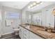 Modern bathroom features dual sinks with granite countertops and a tub shower at 5306 Greens Dr, Lady Lake, FL 32159
