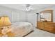 Comfortable bedroom features a double bed, dresser, and closet at 5306 Greens Dr, Lady Lake, FL 32159