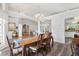 Spacious dining area with hardwood floors and a view into the living room at 5306 Greens Dr, Lady Lake, FL 32159