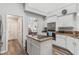 Kitchen featuring stainless steel appliances, granite countertops, and hardwood floors at 5306 Greens Dr, Lady Lake, FL 32159