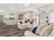 Living room with wood floors, neutral paint, and a view of the front entrance at 5306 Greens Dr, Lady Lake, FL 32159