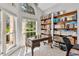 Home office with large windows and a view of the backyard at 5306 Greens Dr, Lady Lake, FL 32159