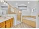 Bathroom featuring a soaking tub, and glass-enclosed shower at 5433 County Road 125, Wildwood, FL 34785
