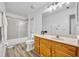 Bathroom with sink, toilet, and shower at 5433 County Road 125, Wildwood, FL 34785
