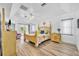 Spacious bedroom with tray ceilings and access to lanai at 5433 County Road 125, Wildwood, FL 34785