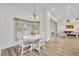 Sunny dining nook featuring large windows and access to living room and backyard at 5433 County Road 125, Wildwood, FL 34785