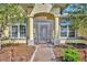 Welcoming front entryway with an ornate security door and decorative sidelight windows at 5433 County Road 125, Wildwood, FL 34785