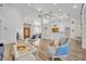 Bright and open living space with views into the kitchen and access to other rooms at 5433 County Road 125, Wildwood, FL 34785