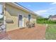 Outdoor patio area with seating, providing a cozy space for enjoying the beautiful backyard view at 5433 County Road 125, Wildwood, FL 34785
