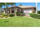 The Monarch clubhouse provides residents with amenities to enhance community living. Well maintained landscaping creates curb appeal at 5614 King James Ave, Leesburg, FL 34748