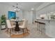 Dining area with contemporary lighting, bar seating, and modern decor at 5614 King James Ave, Leesburg, FL 34748