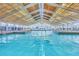 The indoor pool features a large skylight ceiling, making the facility available for residents to enjoy throughout the year at 5614 King James Ave, Leesburg, FL 34748