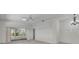 Spacious room features neutral walls, lots of light and sliding glass doors to the outside at 5614 King James Ave, Leesburg, FL 34748