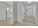 Open-concept living space with tile flooring and view into the kitchen and living room at 5614 King James Ave, Leesburg, FL 34748