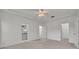Spacious main bedroom with a ceiling fan, and doorways to the ensuite bathroom and walk-in closet at 5614 King James Ave, Leesburg, FL 34748