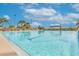 The outdoor swimming pool offers ample space and lounge chairs to enjoy the beautiful weather and community amenities at 5614 King James Ave, Leesburg, FL 34748