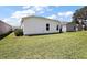 This property includes a spacious backyard with lush green lawn, offering ample outdoor space at 5817 Valente Ct, The Villages, FL 32163