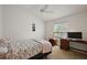 Cozy bedroom with natural light and a comfortable workspace at 5817 Valente Ct, The Villages, FL 32163