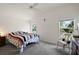 Bright bedroom with vaulted ceilings, ample natural light, and neutral colors at 5817 Valente Ct, The Villages, FL 32163