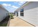 The house offers a concrete walkway and outdoor space, plus low maintenance landscaping at 5817 Valente Ct, The Villages, FL 32163