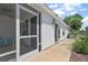 This property boasts a screened porch, concrete walkway, and manicured landscaping at 5817 Valente Ct, The Villages, FL 32163