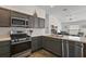 This kitchen features modern appliances and white countertops at 5817 Valente Ct, The Villages, FL 32163