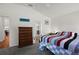 Comfortable primary bedroom with an ensuite bathroom and spacious layout at 5817 Valente Ct, The Villages, FL 32163